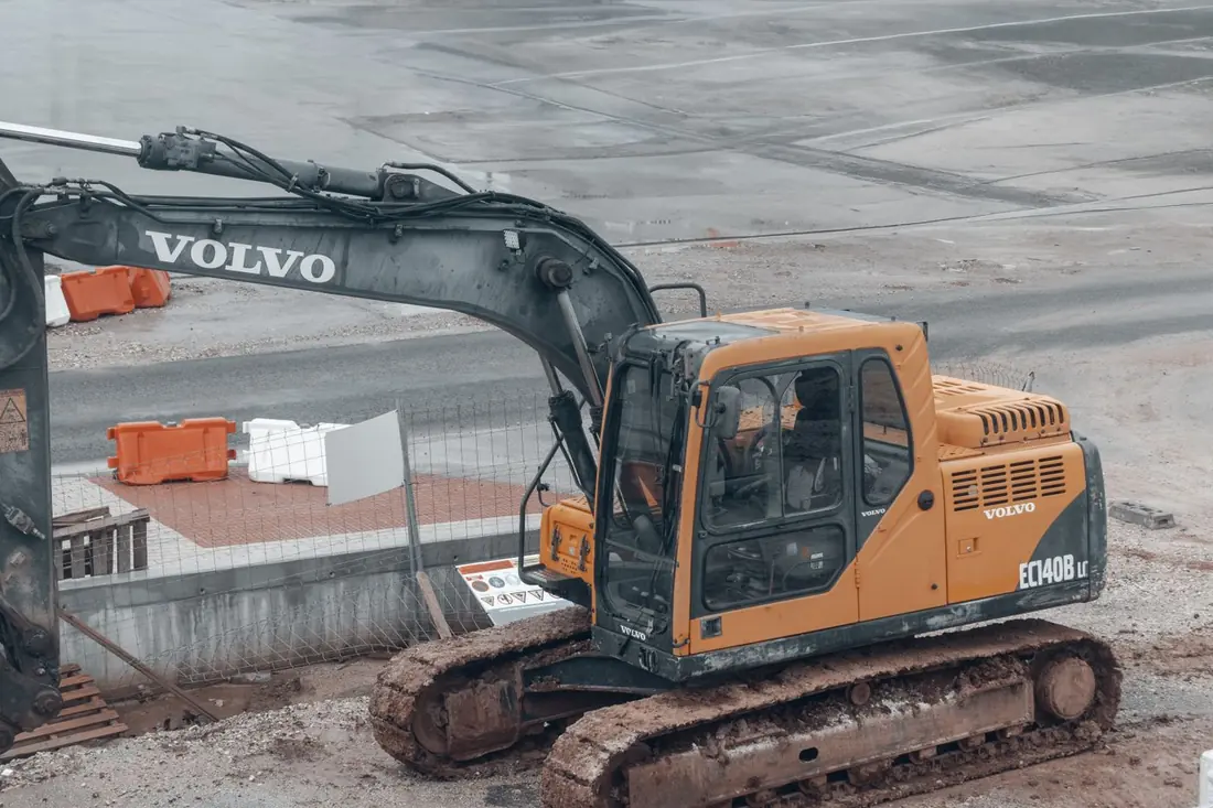 Tracked excavator showing its steel track undercarriage